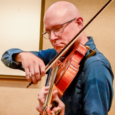 NE adjunct music instructor Stephen Beall performs during the string faculty concert.